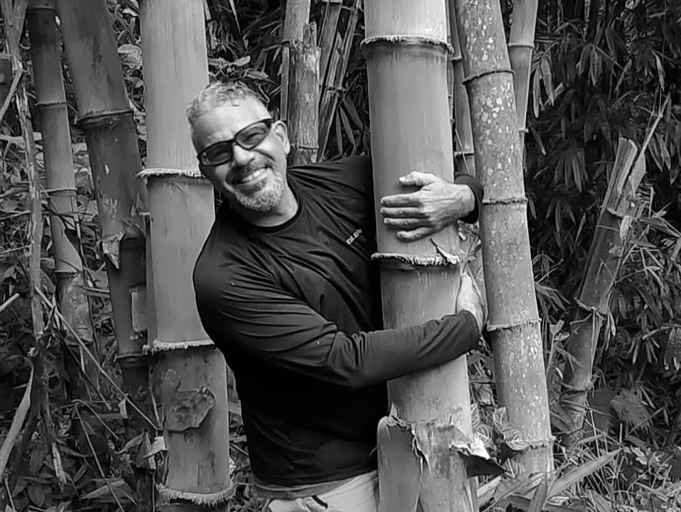 Bamboo Master James Wolf hugs bamboo